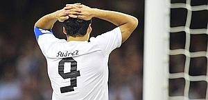 Uruguay's striker Luis Suarez reacts after missing a goal opportunity during the London 2012 Olympic Games men's football match between Britain and Uruguay at the Millennium Stadium in Cardiff, Wales, on August 1, 2012. AFP PHOTO / GLYN KIRK