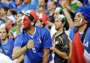 epa03271962 Fans of Italy celebrate after their team scored the 1-0 lead during the Group C preliminary round match of the UEFA EURO 2012 between Italy and Ireland in Poznan, Poland, 18 June 2012. EPA/AIDAN CRAWLEY UEFA Terms and Conditions apply http://www.epa.eu/downloads/UEFA-EURO2012-TCS.pdf