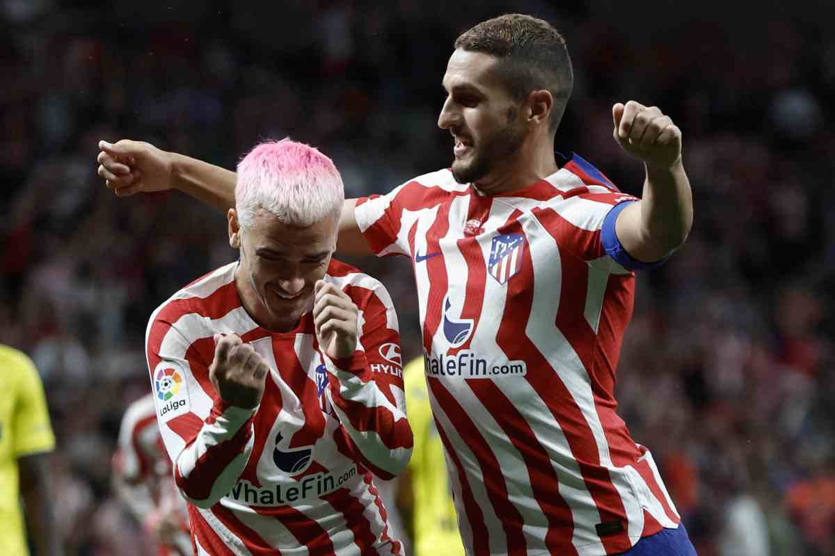 Koke  esulta con Griezmann dopo un gol