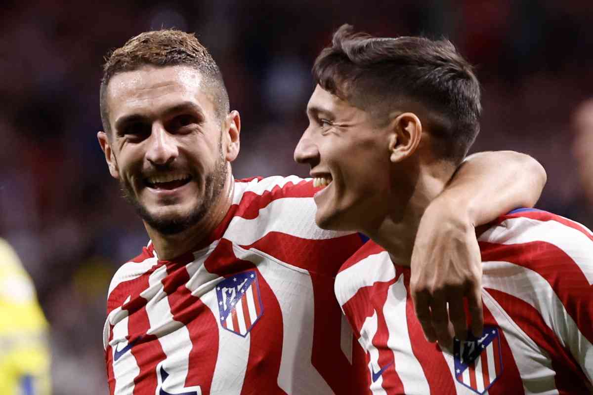 Koke esulta con Molina dopo un gol